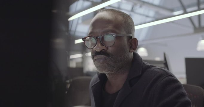 African american businessman working on desktop computer