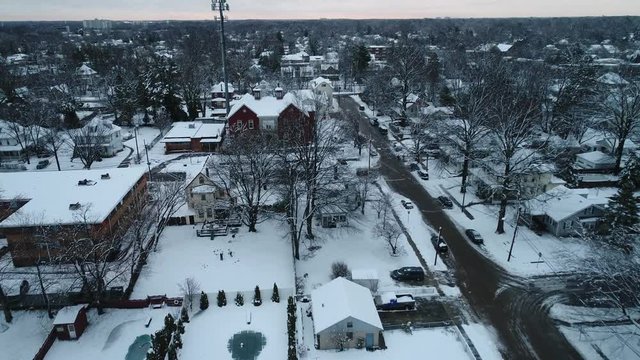 Aerial View of a Small Town Covered in Snow on a Cold Winter Day