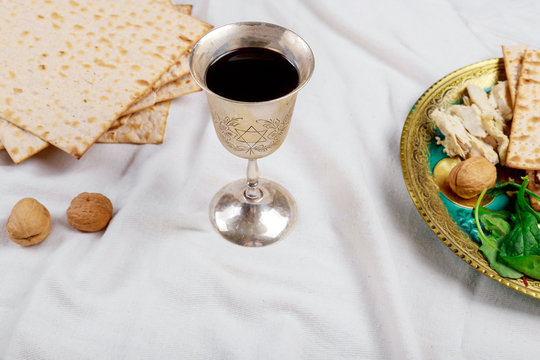 Jewish Pesah celebrating, matzoh and traditional seder plate
