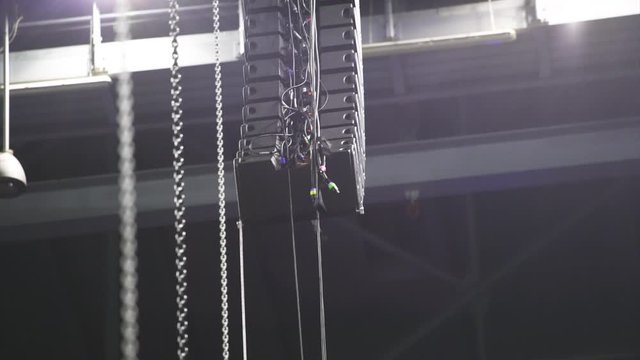 Installation of professional sound equipment for a concert.