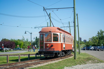 Fototapeta na wymiar Historic trolley transit train running with passengers