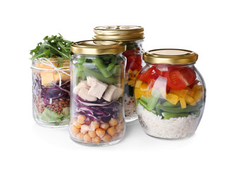 Fototapeta na wymiar Glass jars with healthy meal isolated on white
