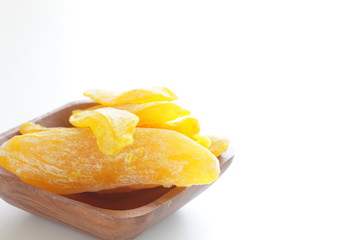 Dried mango from from vietnam on wooden plate