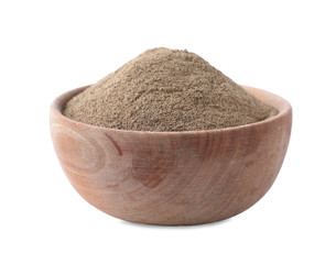 Spicy milled black pepper in wooden bowl isolated on white