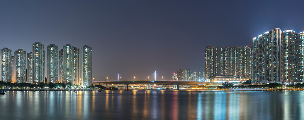 Obraz na płótnie Canvas Panorama of harbor and skyline of Hong Kong city at night