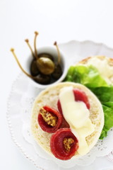 toasted English muffin and salami with cheese