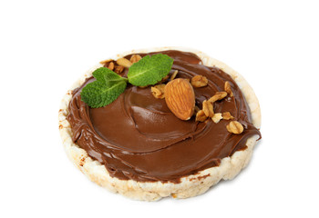 Puffed rice cake with chocolate spread, nuts and mint isolated on white