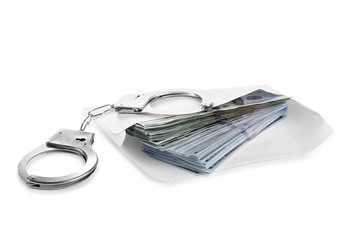 Envelope with dollar bills and handcuffs isolated on white. Bribe concept