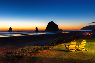 Chairs with a view of the Haystack rock in Cannon Beach