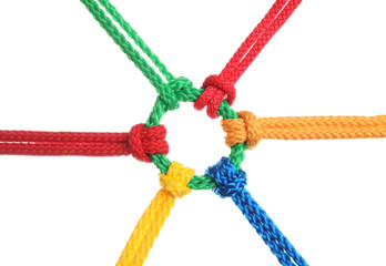 Colorful ropes tied together isolated on white. Unity concept