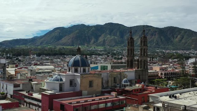 Tepic Cathedral Neo-Gothic catholic temple in city centre of Tepic, Nayarit in Mexico. Aerial drone view of Tepic and San Juan mountain.