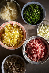 Dumpling meat and vegetable ingredient in bowls 