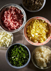 Dumpling meat and vegetable ingredient in bowls 