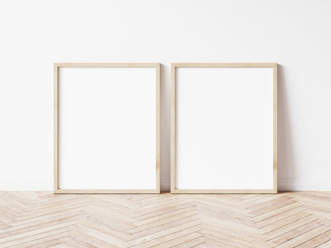 Two vertical wooden frame mockup. Two mock up poster on wooden floor. 2 frame 3d illustrations.