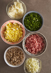 Dumpling meat and vegetable ingredient in bowls 