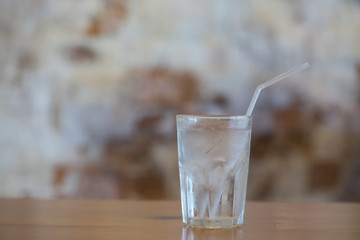 Pouring water from bottle into glass