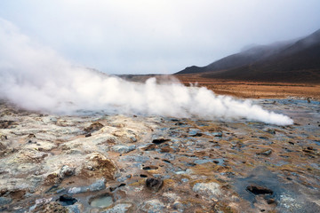 Hot sulfuric steam vent spewing sulphur steam in the hot sulfuric and geothermal area of Namaskard...