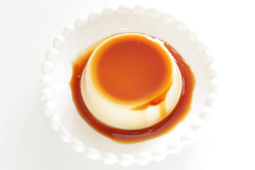 Caramel and baked pudding on white dish
