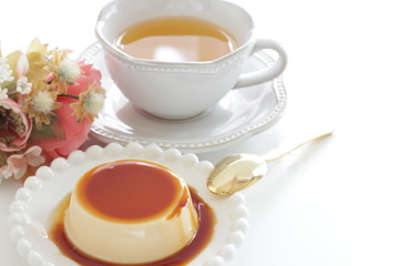 Caramel and baked pudding on white dish