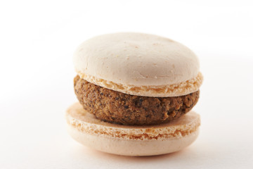Chocolate macaroon on white background 