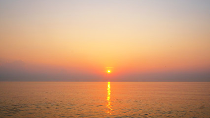 Sunrise cloudy sky and sand beach the winter morning.