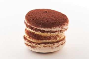 Cocoa powder macaroon on white background 