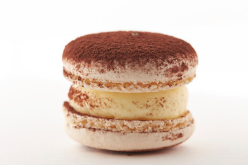 Cocoa powder macaroon on white background 