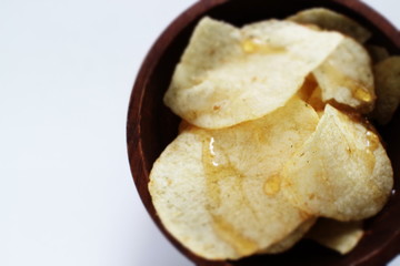 Potato chips and honey for snack food time