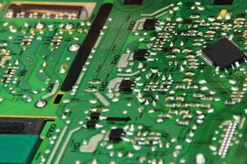 Green modern TV motherboard close up, Digital electronics repair