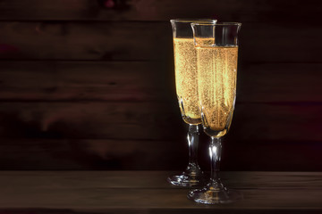 wine glass of sparkling champagne on a dark background
