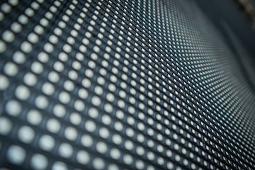 Detail of a LED or LCD panel for screen on concerts or different displays. Focus on a centre row of...