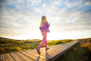 Girl on boardwalk