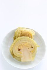 Chinese food, pickled mustard vegetable on dish 