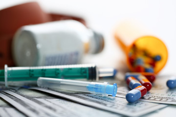 Money dollars used syringe pills and unknown
