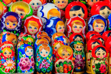 Fototapeta na wymiar Traditional souvenirs from Russia - colorful nesting dolls, also known as matryoshka, babushka, stacking dolls, or Russian dolls