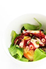 Japanese food, boiled octopus and baby leaf vegetable salad