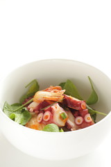 Japanese food, boiled octopus and baby leaf vegetable salad