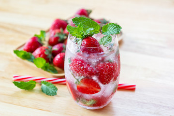 fresh Strawberry mojito cocktail with ice and mint in glass