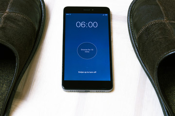 Wake up with an alarm clock in the early morning, put on slippers