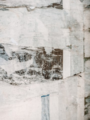 Vintage old posters sticked and torn on wall for your grunge background