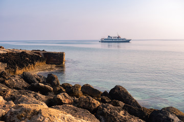 Cruise Yacht. The ship floats on the sea. Sea tour. The ship floats to the shore. Tourist yacht...