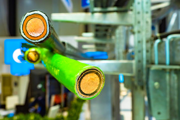 Wire cutaway. Concept - production of copper wires. Large diameter electrical wires. Multi-colored...