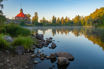 Karelia. Russia. Fortress Korela. Panorama of the lake and the stone tower. Fortress in the city of...