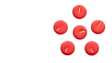 Round colored tea candle. Small candlelight, decoration.