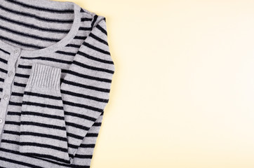 Textile, shirt composition on color background. Flat lay.