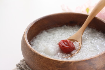 Japanese  food, Umeboshi and healthy rice congee in wooden bowl