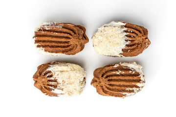 Chocolate shortbread cookies with coconut isolated on white background.