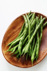 Freshness green bean on wooden plate for healthy food ingredient