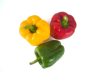 Obraz na płótnie Canvas Bell peppers green red red yellow white background