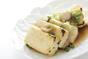 Pan fried tofu and scallion with soy sauce for healthy food image
